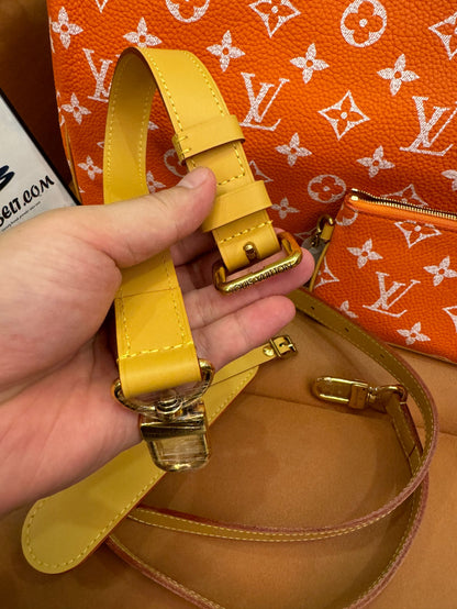 Bandoulière rápida de lona naranja con monograma de Louis Vuitton 30