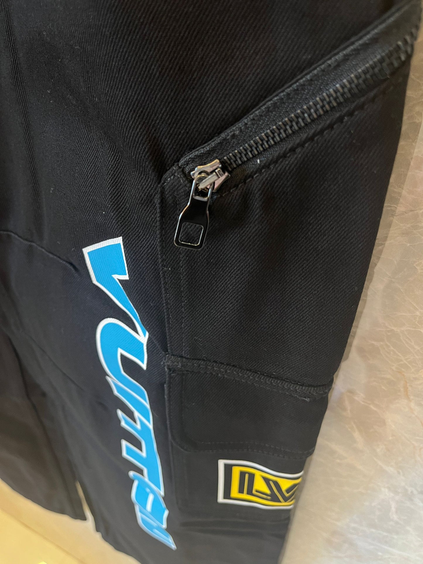 Calça jeans estampada de corrida Louis Vuitton