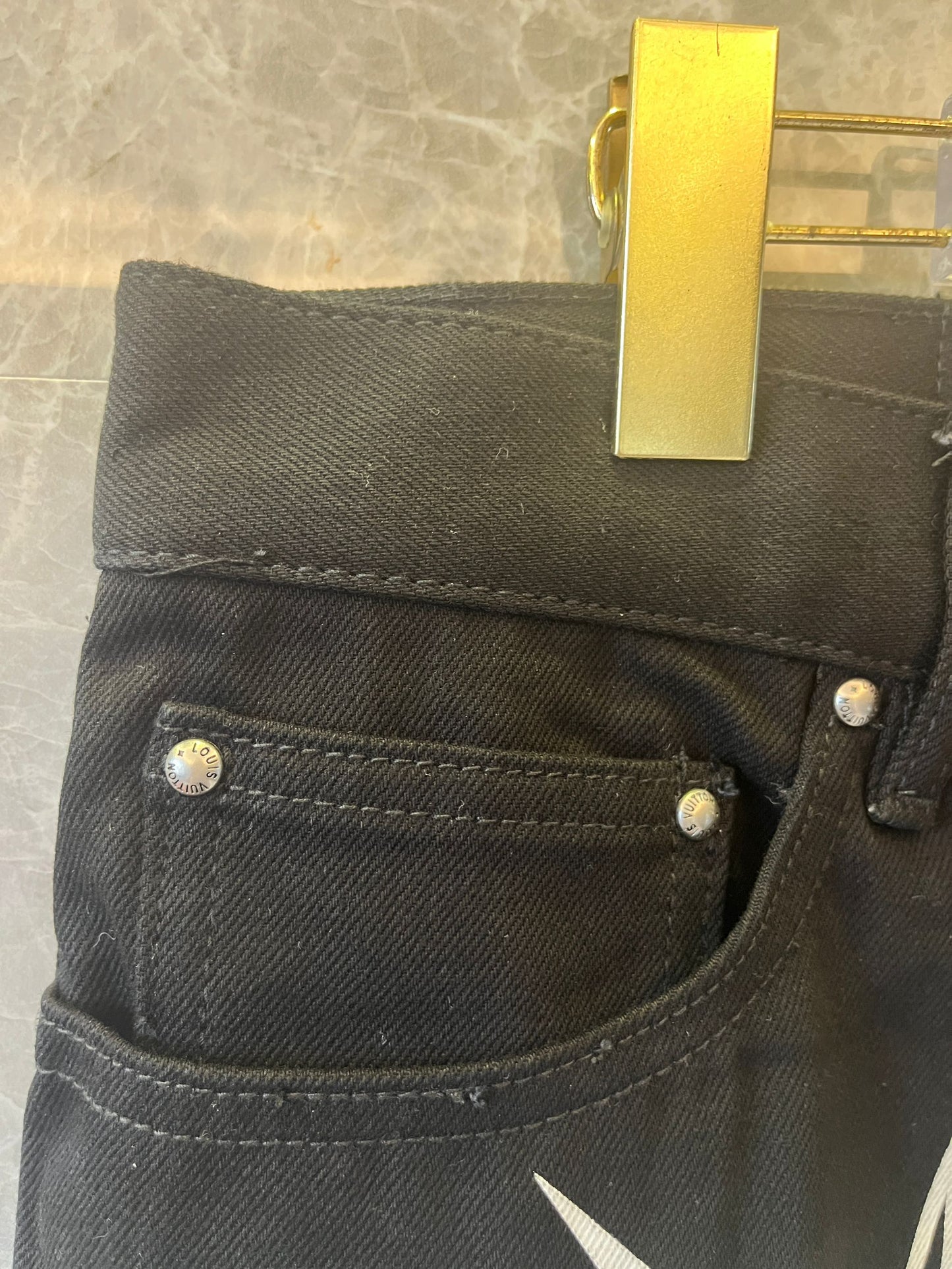 Calça jeans estampada de corrida Louis Vuitton