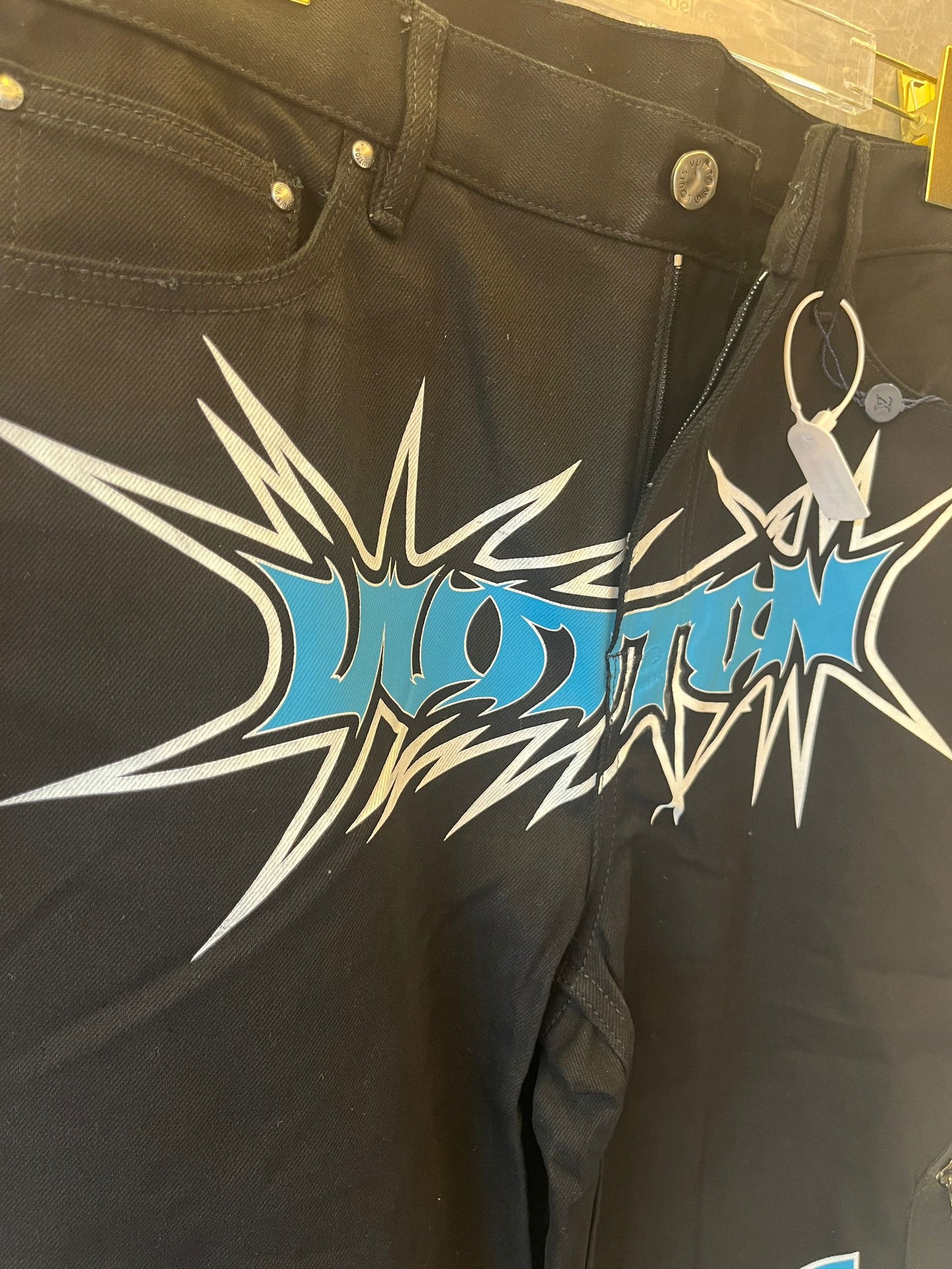 Calça jeans estampada de corrida Louis Vuitton
