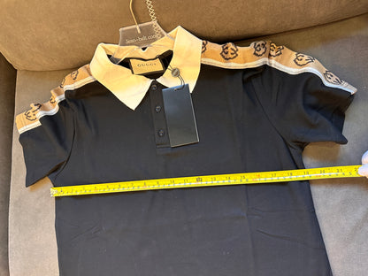 Polo negro de piqué de algodón elástico con ribete de cinta jacquard y logotipo de Gucci