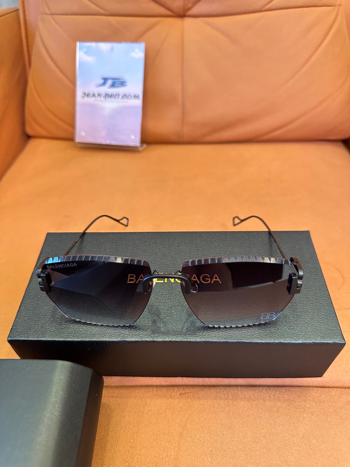 Balenciaga BB0174Q 007T Rimless Sunglasses – Black Studded Shield Sesign