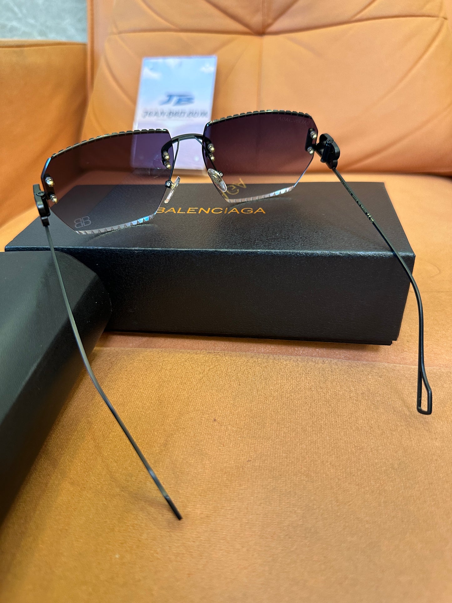 Balenciaga BB0174Q 007T Rimless Sunglasses – Black Studded Shield Sesign
