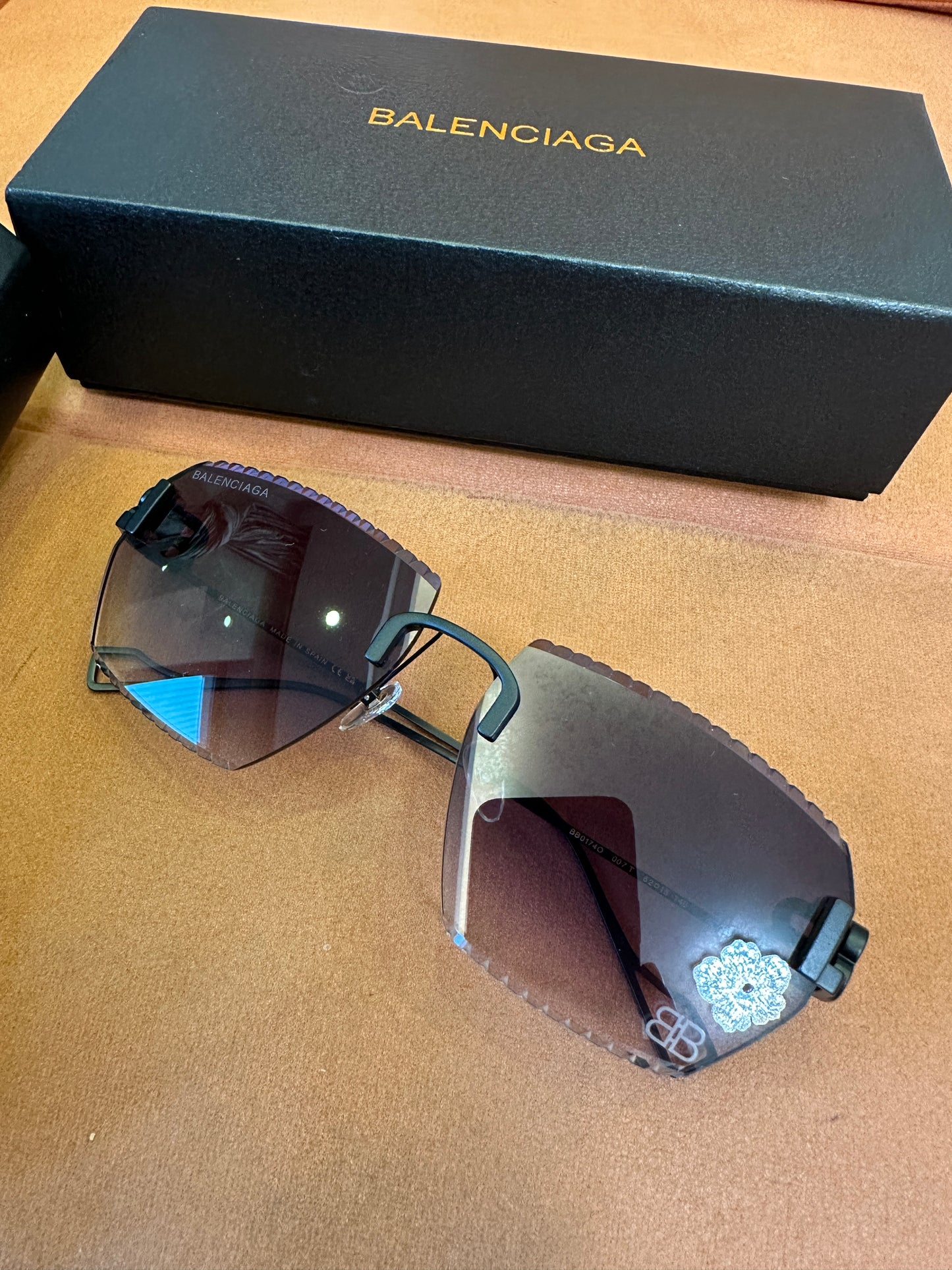 Balenciaga BB0174Q 007T Rimless Sunglasses – Black Studded Shield Sesign