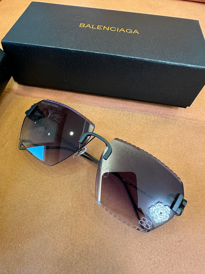 Balenciaga BB0174Q 007T Rimless Sunglasses – Black Studded Shield Sesign