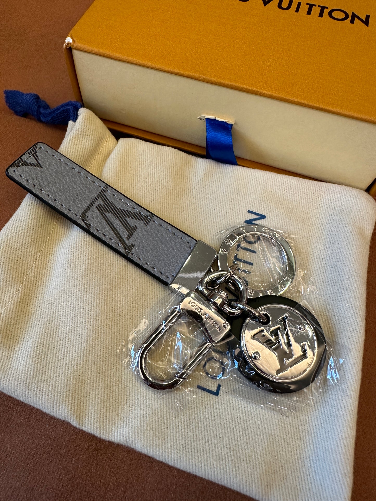 Louis Vuitton Dual-Sided Key Holder with Monogram Charm – Grey & Black Leather Strap