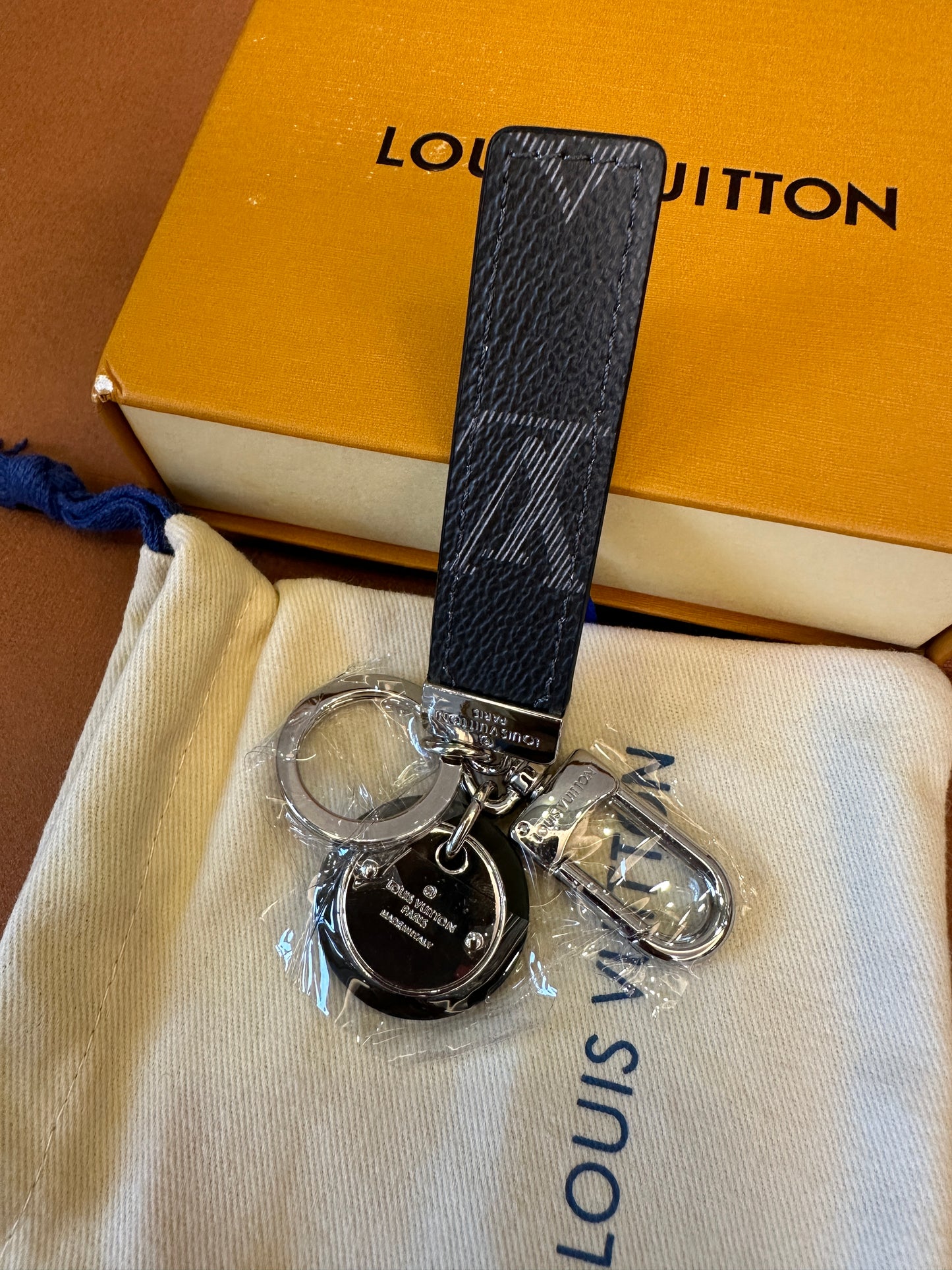Louis Vuitton Dual-Sided Key Holder with Monogram Charm – Grey & Black Leather Strap