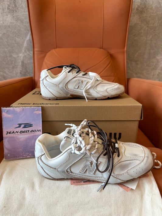 Miu Miu x New Balance Leather Distressed Sneakers Beige