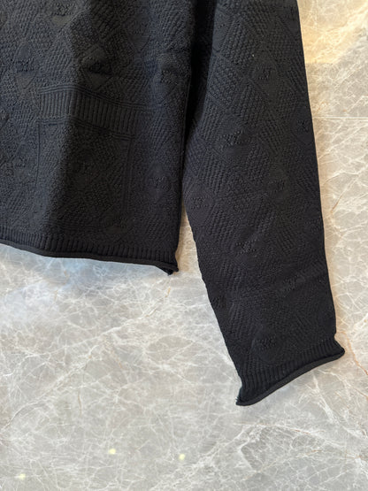 Cardigan Chanel em malha texturizada preta com botões logótipo CC