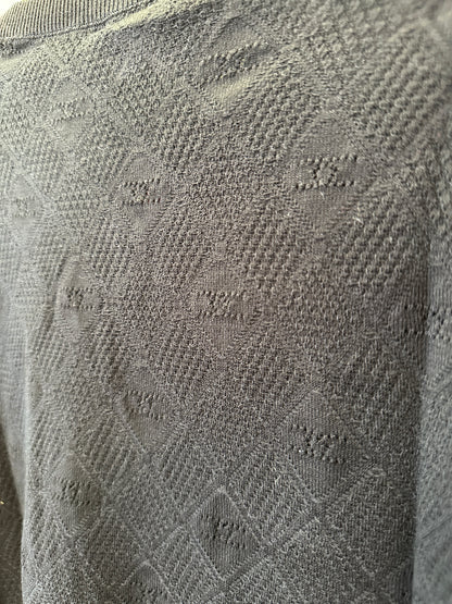 Cardigan Chanel em malha texturizada preta com botões logótipo CC