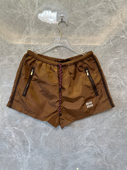 Calções Miu Miu castanhos de nylon com cordão