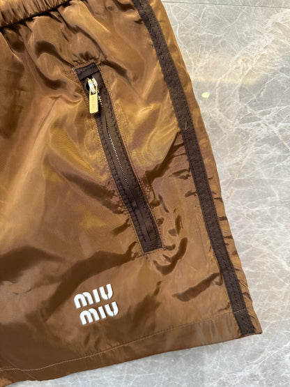 Calções Miu Miu castanhos de nylon com cordão