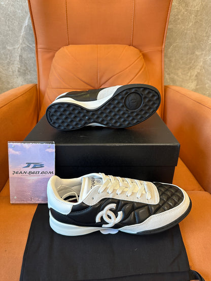 Chanel Quilted Black White Low Top Sneakers