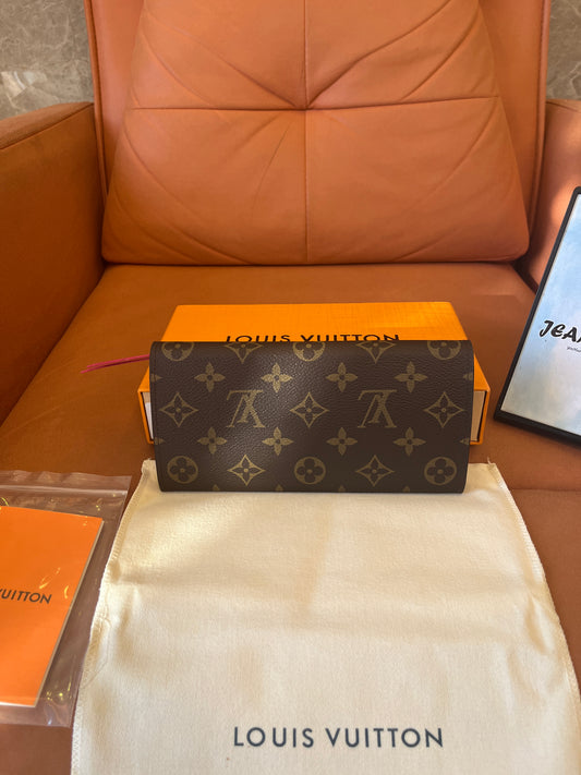 Carteira Louis Vuitton Emilie com monograma em tela rosa fúcsia