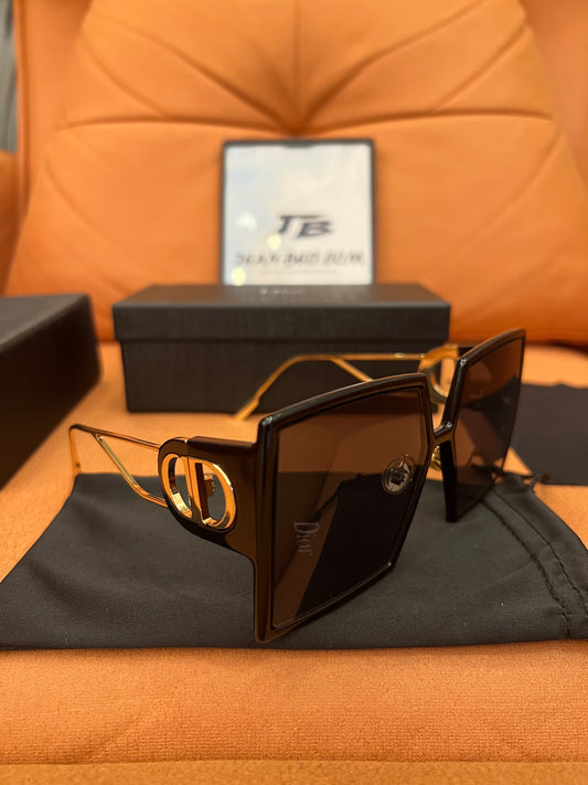 Gafas de sol rectangulares negras Dior con montura dorada
