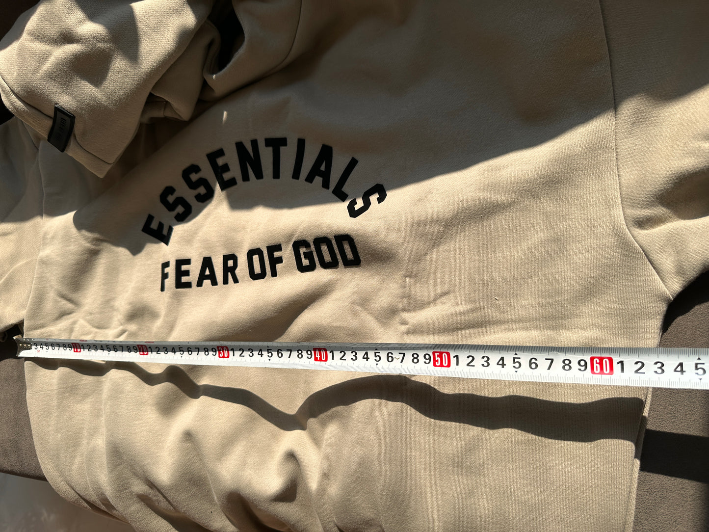 Moletom oversized Fear of God Essentials em tom taupe