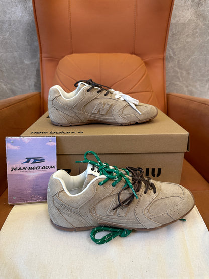 Miu Miu x New Balance 574 Collaboration Sneakers