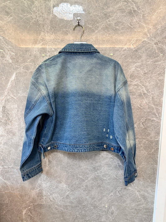 Chaqueta vaquera lavada de Prada con logotipo triangular