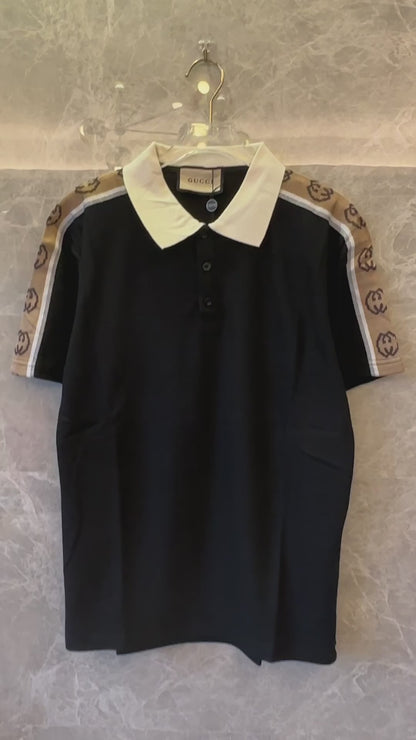 Polo negro de piqué de algodón elástico con ribete de cinta jacquard y logotipo de Gucci